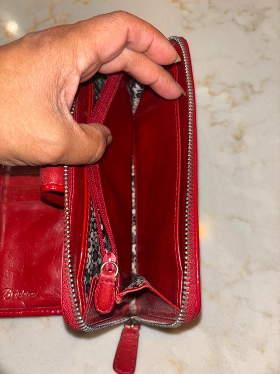 Brighton Red leather wallet featuring a decorative silver-toned snap closure. - Picture 6 of 16